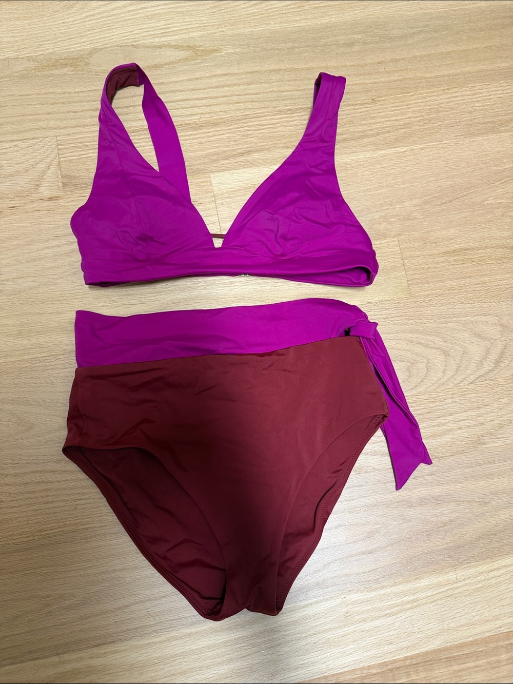 Athleta women’s two-piece bathing suit, magenta and burgundy colors.